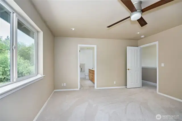 Nice sized primary bedroom with 5 piece bath beyond.