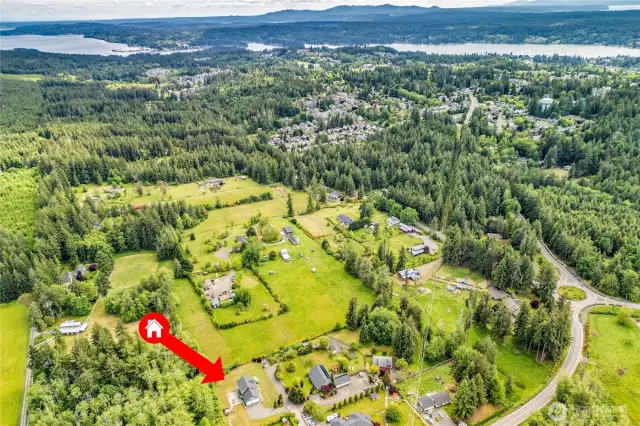 Views of the property and surrounding parcels with Liberty Bay and Puget Sound beyond.