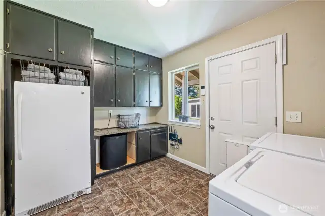 Mud room with door to backyard
