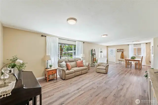 Looking towards entry. Newer laminate flooring throughout home.
