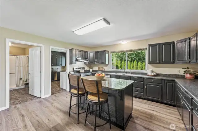 Kitchen with views of 3/4 bath and mud room