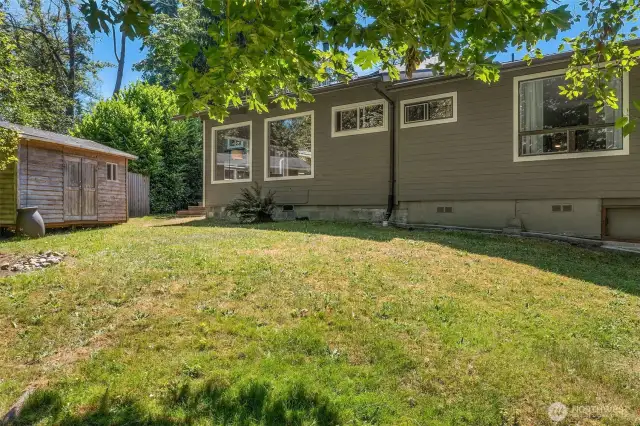 Back lawn with firepit
