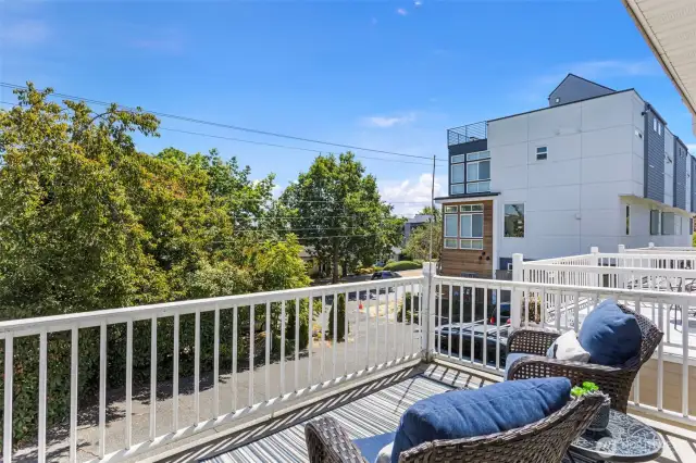 One of two decks. This one out front off the living room, separated from the street by the driveway and large hedge.