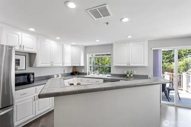 The center island for cooking and add some barstools to entertain the cook!