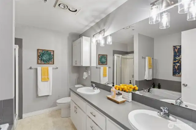Primary ensuite full bathroom with stand alone shower and double vanity.