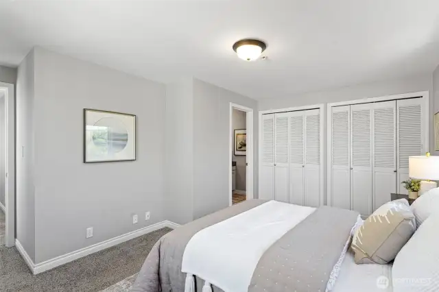This 2nd bedroom is down the hall from the primary and has its own full bathroom.