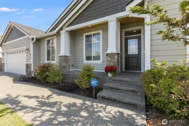 Stone accents on garage and porch add to the curb appeal.