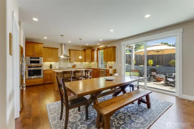 Space for a table large enough to fit 8 if needed. Oversized sliding door lets in an abundance of light and offers easy access to the back patio.