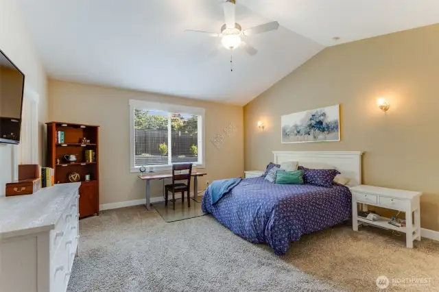 In addition to being spacious, the primary bedroom is at the opposite side of the home from the other bedrooms.