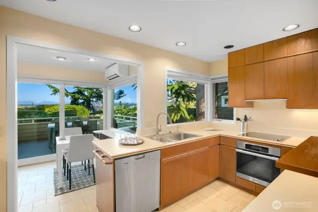 Kitchen has small eating area that leads to view deck with Mt Rainier views