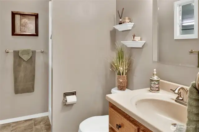 A convenient 3/4 bath is located just off the garage, perfect for guests or quick access from outside.