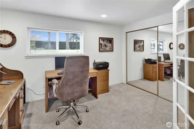 The fourth bedroom or office is conveniently located off the basement rec room, offering flexibility for work, guests, or hobbies.