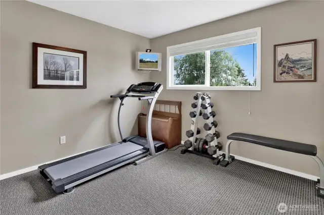 One of three upstairs bedrooms, this room faces south, filling the space with natural light.