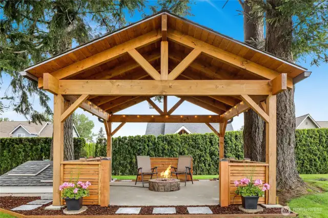 This exquisite gazebo is a showstopper, offering elegant shelter and serene shade—a perfect retreat for entertaining or unwinding in style.