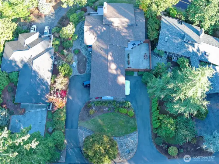 aerial view of home from Jefferson St. Garage entry on left. Additional parking on right side into outside patio and entry.