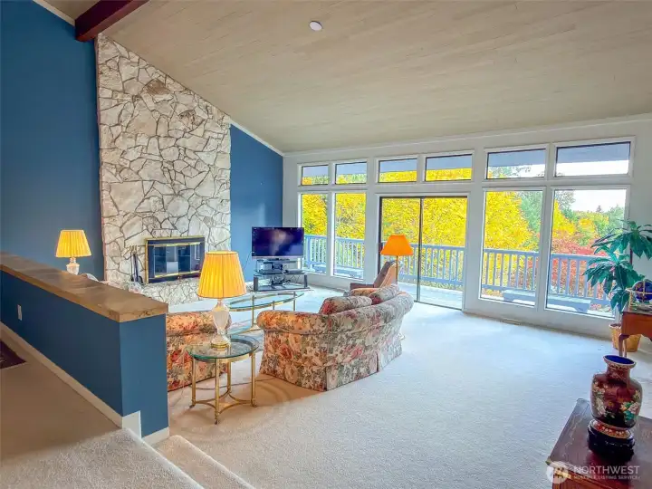 Huge living room with stone fireplace and vaulted ceilings