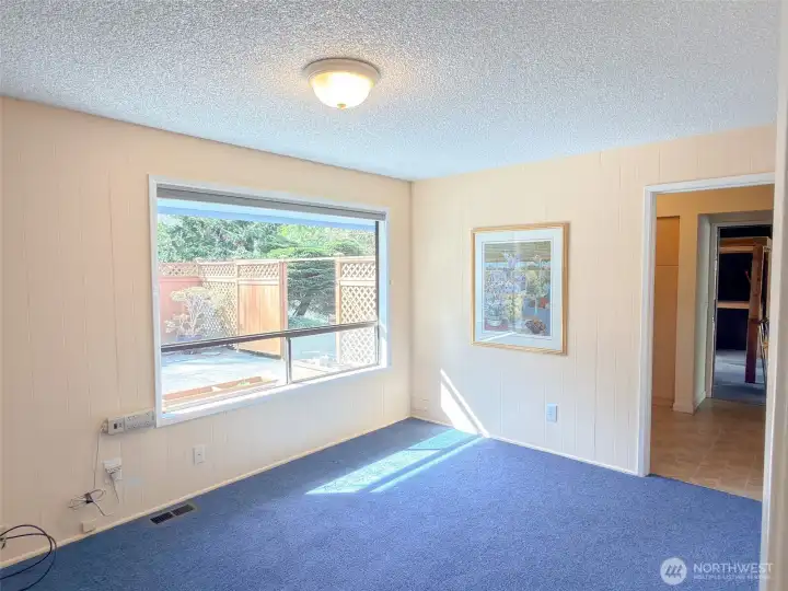 3rd bedroom main level. Great Bonus room. Access to Laundry and garage from here.