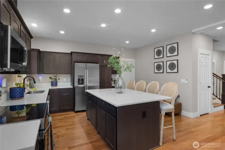 Island with eating area in the kitchen.