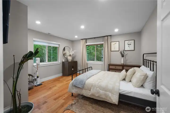 Bedroom 2 with tree view and green around.