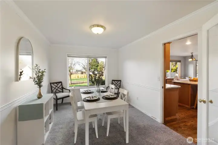 Formal dining adjacent to formal living with easy access to kitchen