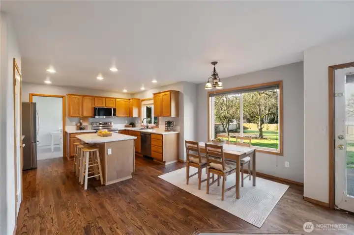 Kitchen with eating area and island.  Lots of light and view of the backyard