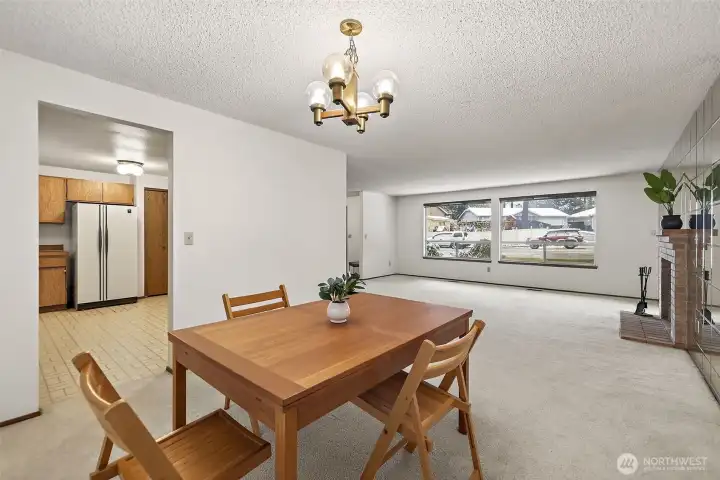 Formal dining room off kitchen and flows into living room.