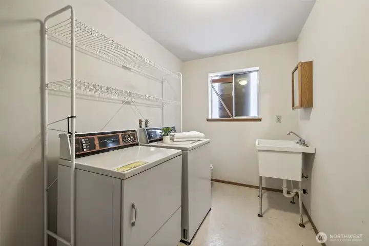 Lower level, half-bathroom and utility.