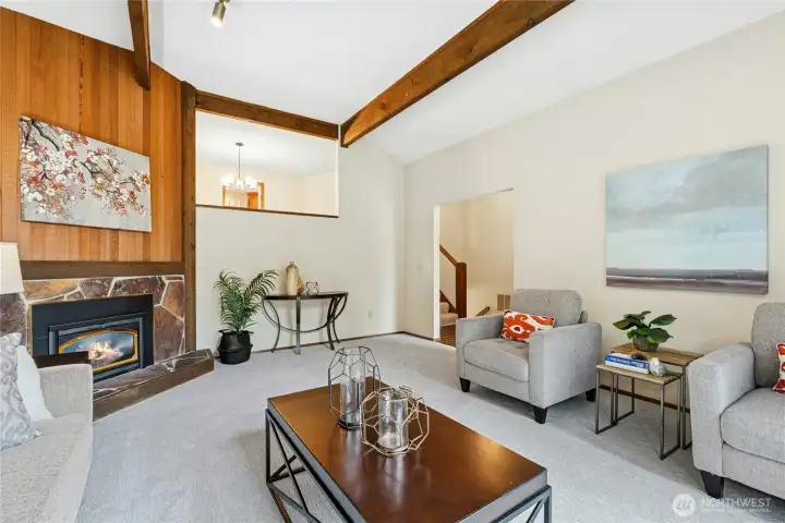 Beautiful architectural wood accents and statement fireplace create a stunning focal point.