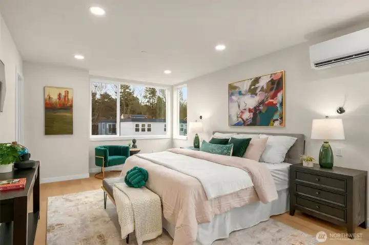 The primary bedroom features a massive space, ensuite bath and closet