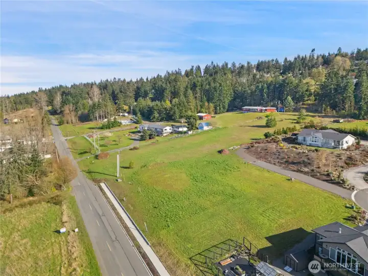Aerial Southeast-facing view over Miller Rd., sidewalk and shared driveway.