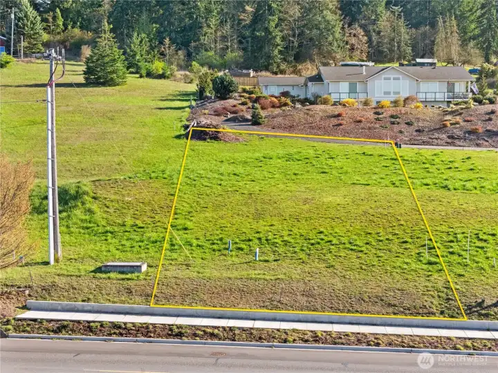 South-facing view from Miller Rd.  Boundary lines are approximate, the East boundary line runs from the top left corner marker to marker by the power pole.  All corners are marked.