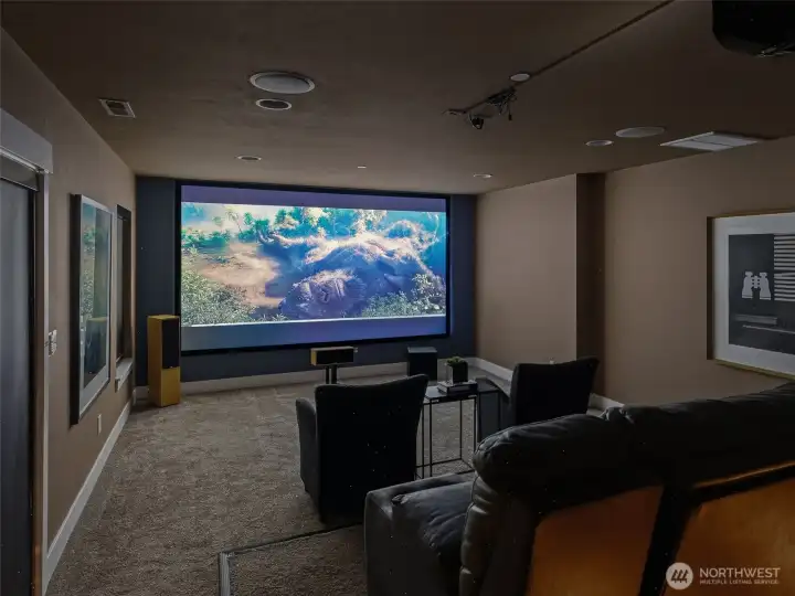 Fully equipped theater room with 150” screen and immersive 7.1 surround sound
