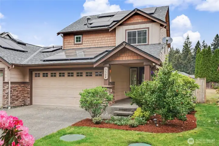 Front view of townhome, only one shared wall to your left and it's the garage wall :). I love the landscaping, large driveway with plenty of parking for you and your guests. PLUS Solar for virtually no summer PSE bills!