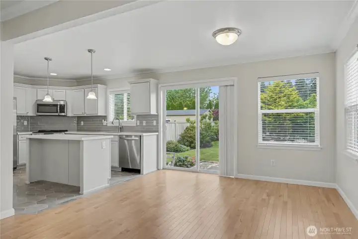 Dining and kitchen view without virtual staging.