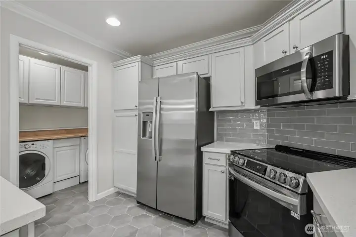 View of your kitchen to your utility room, love the folding table and all the storage!