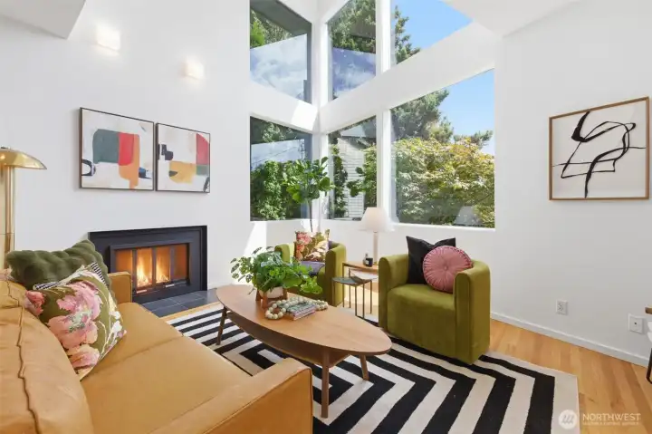 Sunken living room with soaring windows.