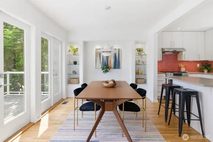 Open dining room with french doors to front deck.