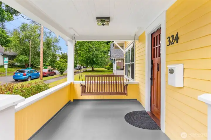 You'll love relaxing on the covered front porch. The home is toward the end of the street, so not much traffic. Just neighbors walking by! You'll love relaxing on the covered front porch. The home is toward the end of the street, so not much traffic. Just neighbors walking by!