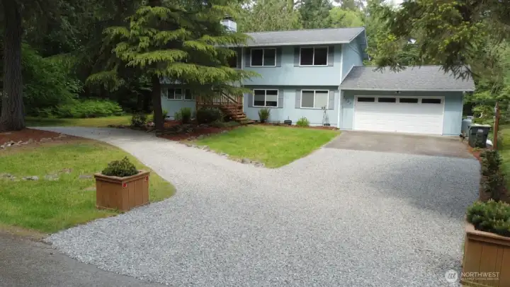 Discover this inviting two-story home nestled on a generous double lot in the Sunwood Lakes community. Surrounded by mature trees and lush landscaping, the property offers privacy, space, and natural beauty right outside your door.