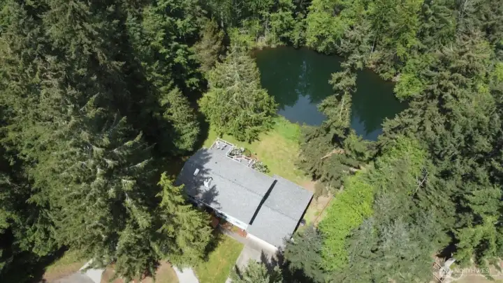 Most of the property is bordered by forested HOA greenspace and the lake.