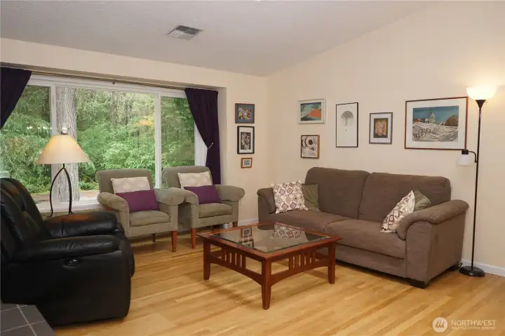 A large picture window looks out to the front yard.