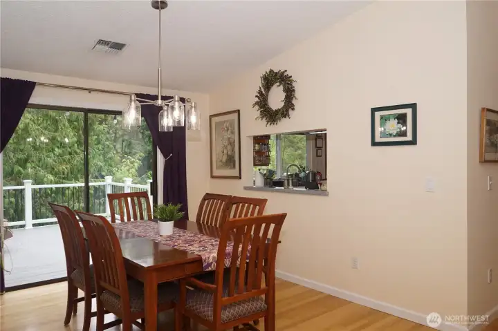 Another view of the dining area showing the passthrough tot he kitchen.