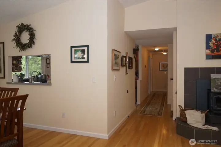 A wide hallway leads to the kitchen, 3 bedrooms and bathroom.