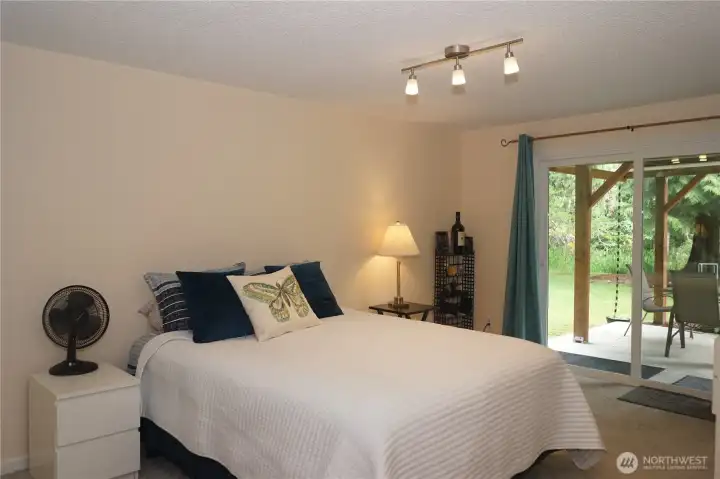 Another view of the lower level bonus room with door to the back patio.