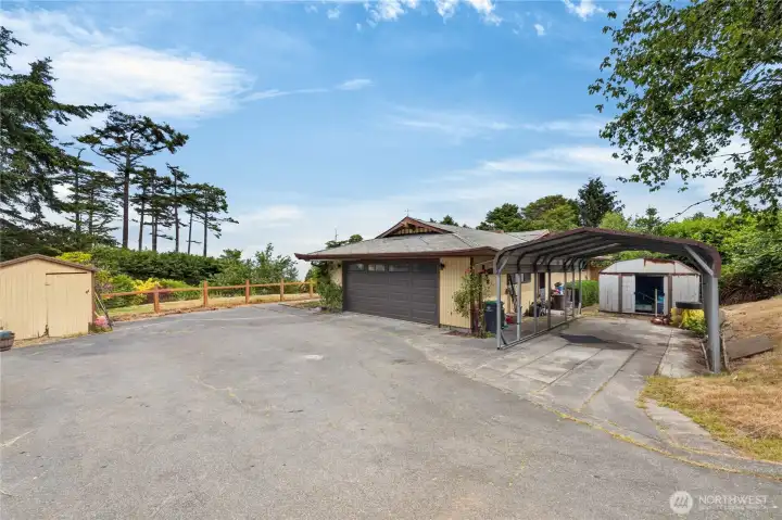 Front of home with two car garage, carport Front of home with two car garage, carport