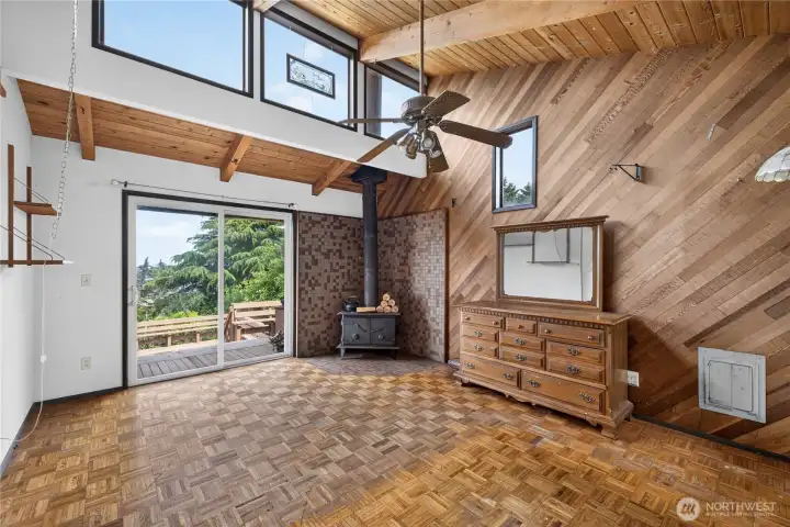 Large Family room on the northwest end of the house. Leads to the expansive water view deck and the back patio on the northside of the home Large Family room on the northwest end of the house. Leads to the expansive water view deck and the back patio on the northside of the home