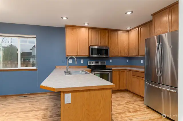 Functional kitchen with eating space.