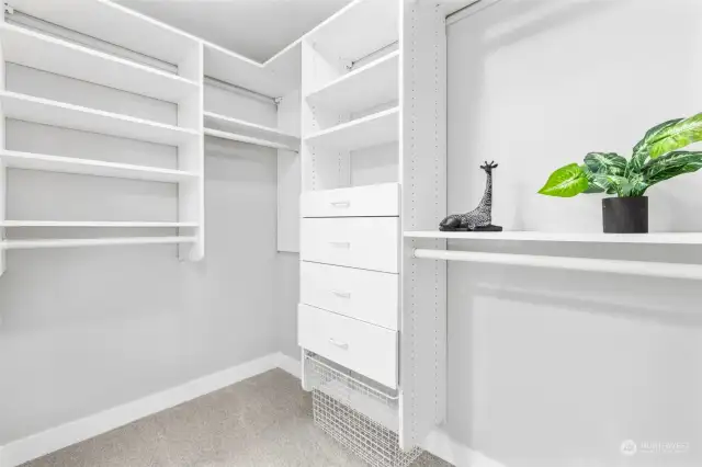 Primary bedroom walk in closet