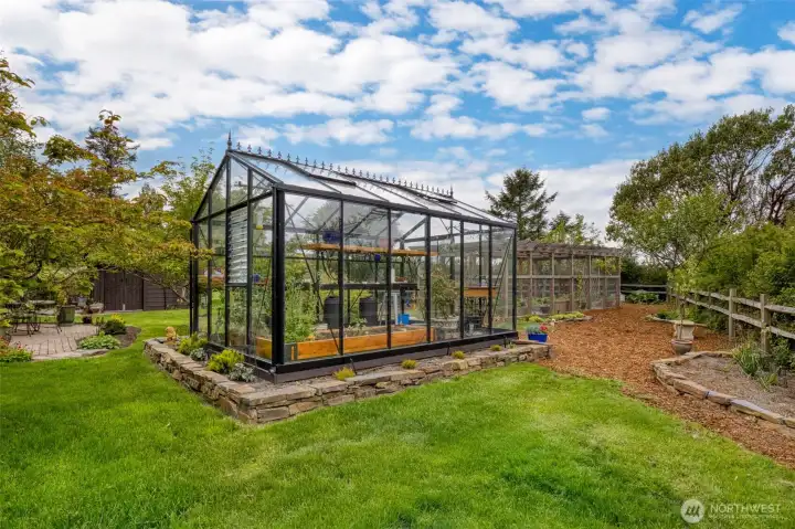 Imported Belgian glass greenhouse for growing your tomatoes and more.