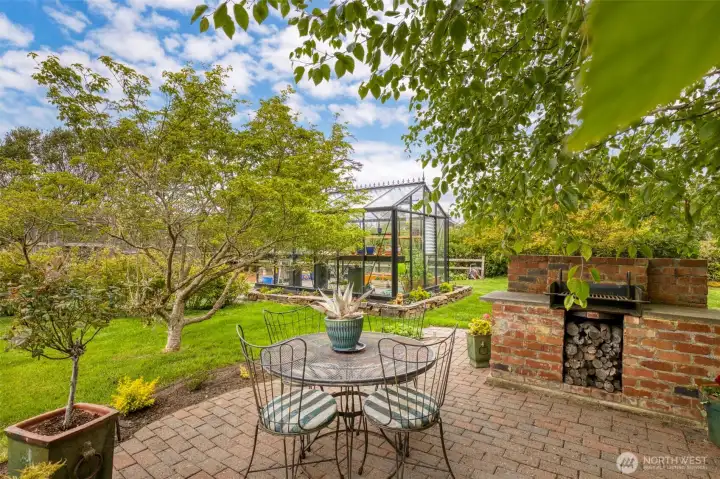 French doors off the kitchen lead you out to the back patio and serene water garden, which is off to the left.